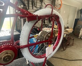 Left side view of rear wheel with new Coker "button" tire and hub in place.